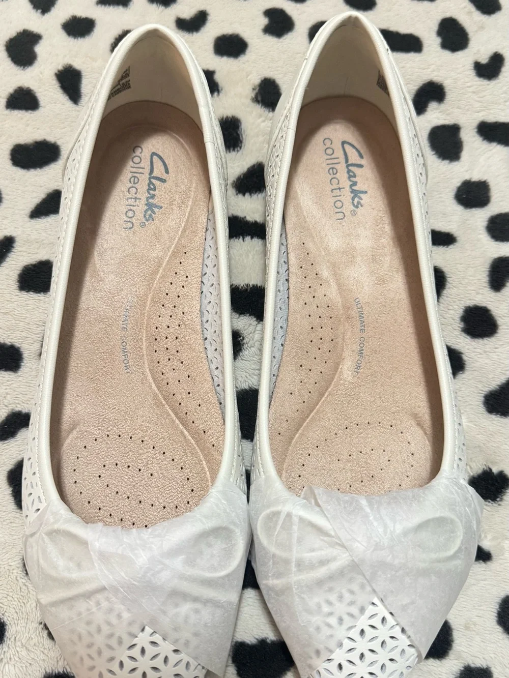 Comfortiva White Laser-Cut Bow Ballet Flats
